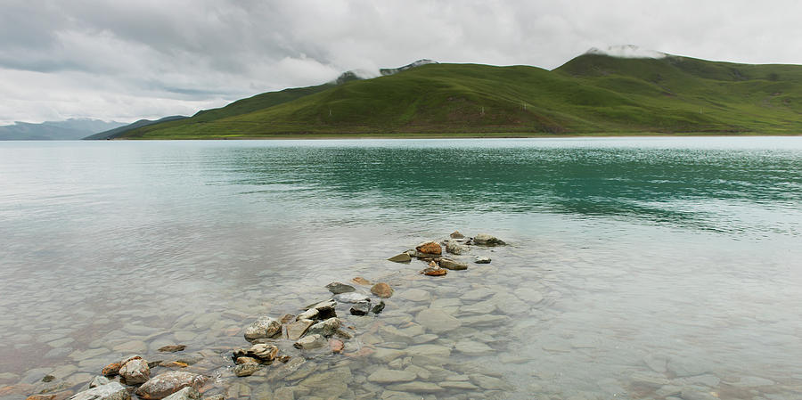 Shoreline Of Sacred Lake Under A Cloudy Photograph by Keith Levit / Design Pics