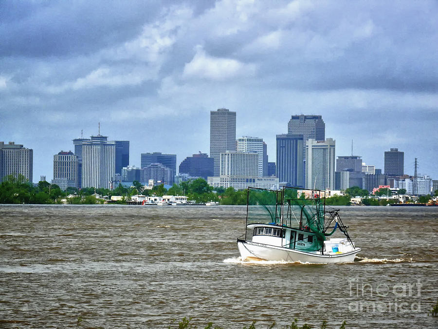 Shrimp Boat going by the City of New Orleans Photograph by Jeanne  Woods