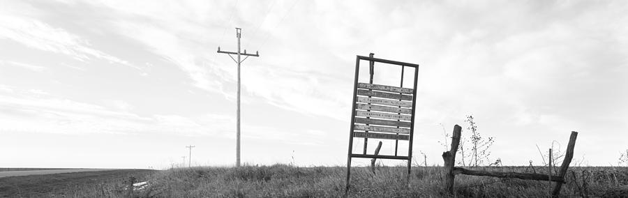 Black And White Photograph - Signboard In The Field, Manhattan by Panoramic Images