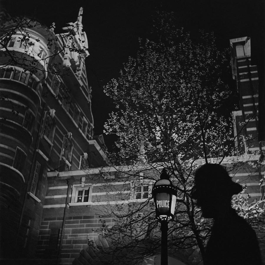 Silhouette Of A British Policeman At Night Photograph by Roger Schall Silhouette Of A British Policeman At Night Photograph by Roger Schall