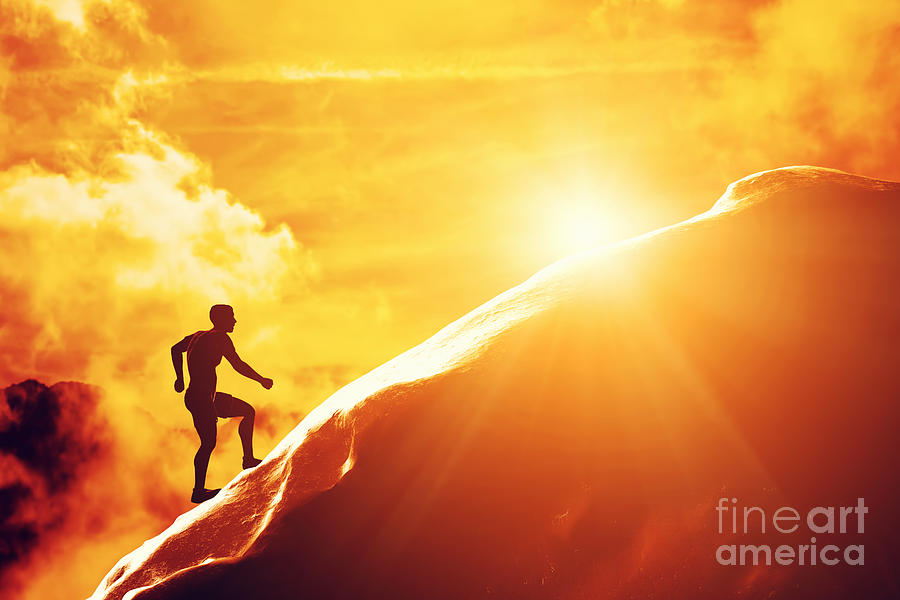 Silhouette Of A Man Running Up Hill To The Peak Of The Mountain