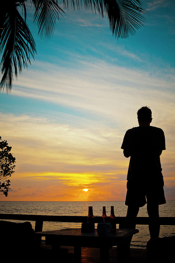 Silhouette Of A Man Watching The Sunset Photograph by Christopher ...