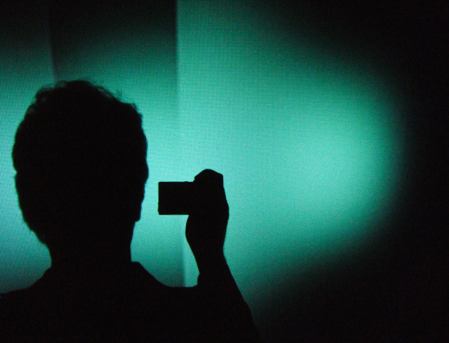 Silhouette of a Photographer green and black Photograph by Matthias Hauser