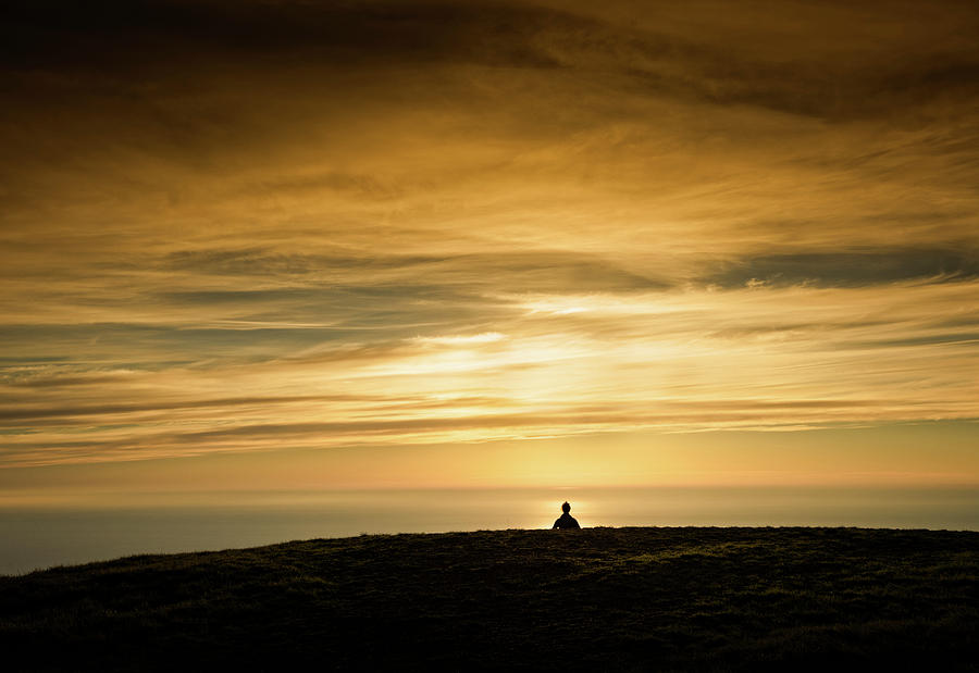 Silhouette Of A Woman Meditating On Top Photograph by Panoramic Images ...