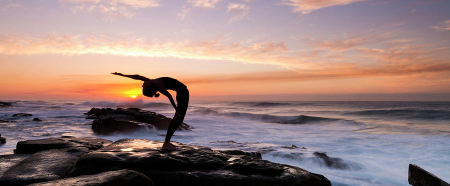 Nature Photograph - Silhouette Of A Woman Practicing Yoga by Panoramic Images