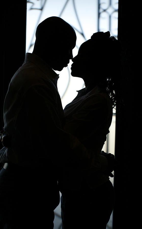 Silhouette of couple gazing closely at each other Photograph by GemaBlanton