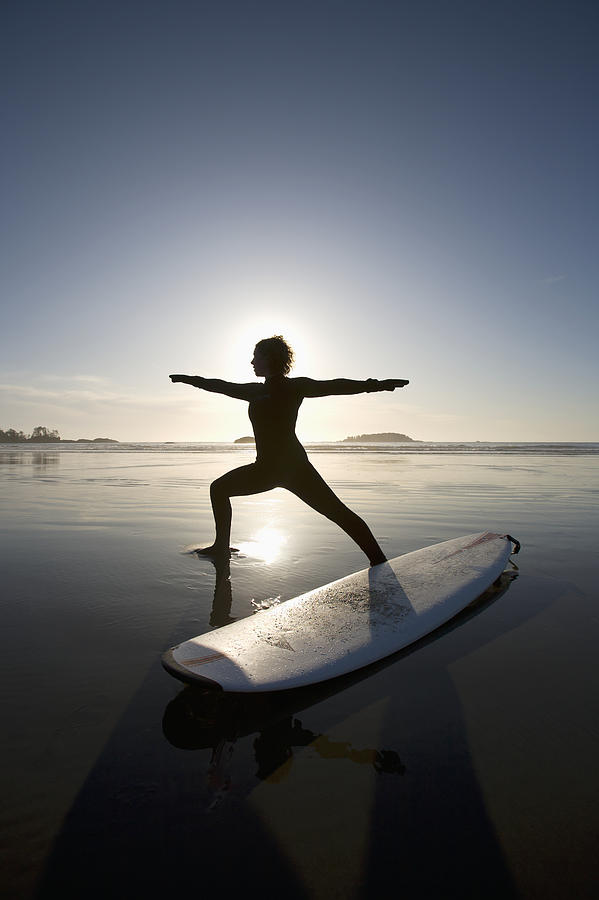 Silhouette Of Female Surfer Doing Photograph by Deddeda - Fine Art America