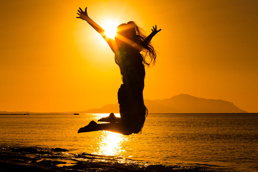 Silhouette Of Girl Jumping Against Sunrise Photograph by 3sbworld