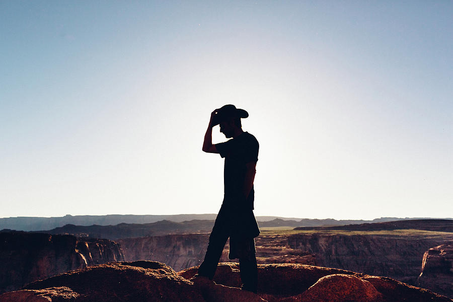Silhouette Of Hiker With Cowboy Hat Photograph by Deimagine