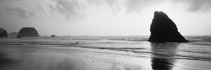 Black And White Photograph - Silhouette Of Rocks On The Beach, Fort by Panoramic Images