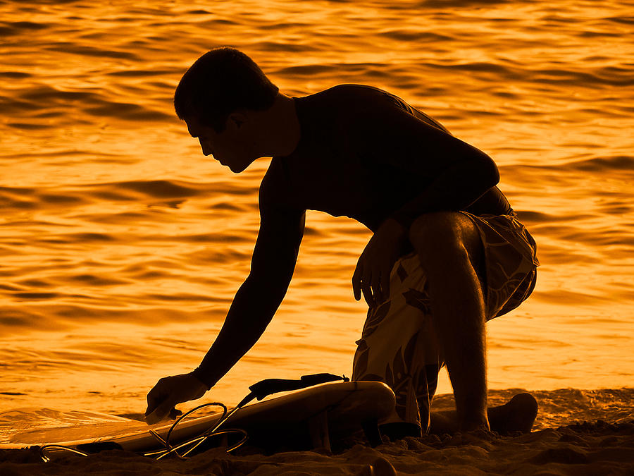 Sunset Photograph - Silhouette of Surfer Waxing Surfboard  by Barbara West