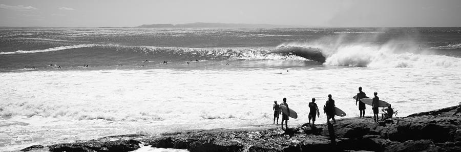 Black And White Photograph - Silhouette Of Surfers Standing by Panoramic Images