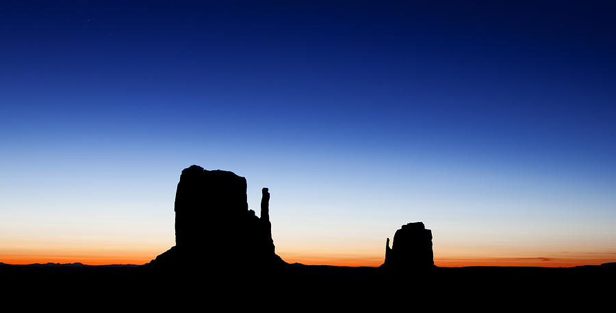 Landmark Photograph - Silhouette of the Mitten Buttes in Monument Valley  by Good Focused