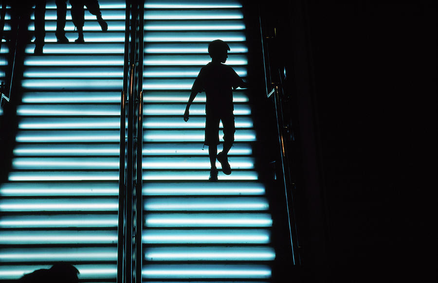 Silhouetted Boy On Illuminated Photograph by Richard Ianson