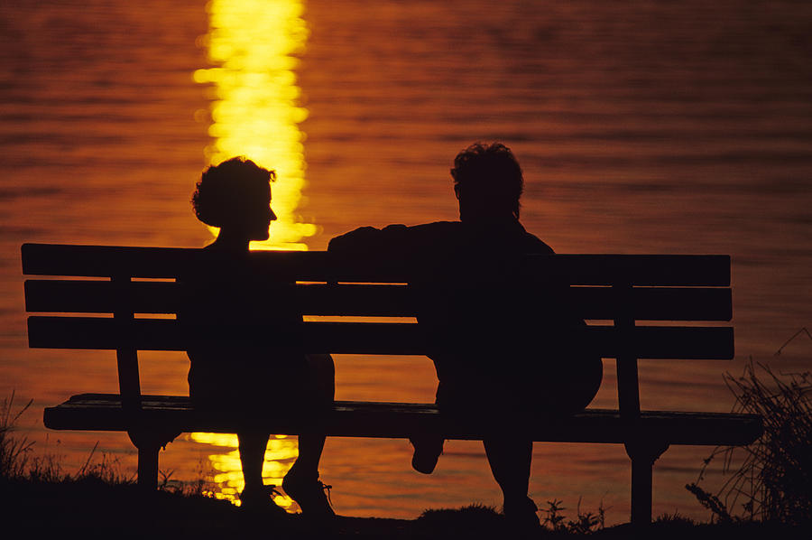 Silhouetted Couple on Park Bench.tif Photograph by Jim Corwin