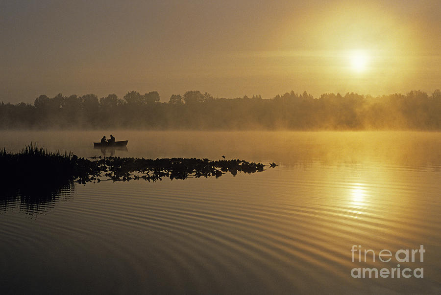 Silhouetted Fishermen Photograph by Jim Corwin