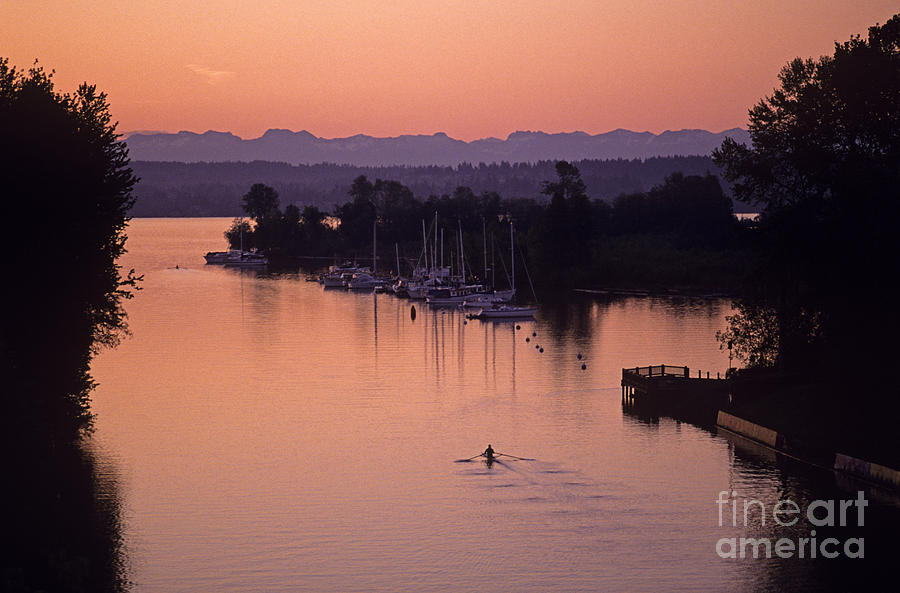 Silhouetted rower on Montlake Cut sunrise opening day of boating Photograph by Jim Corwin