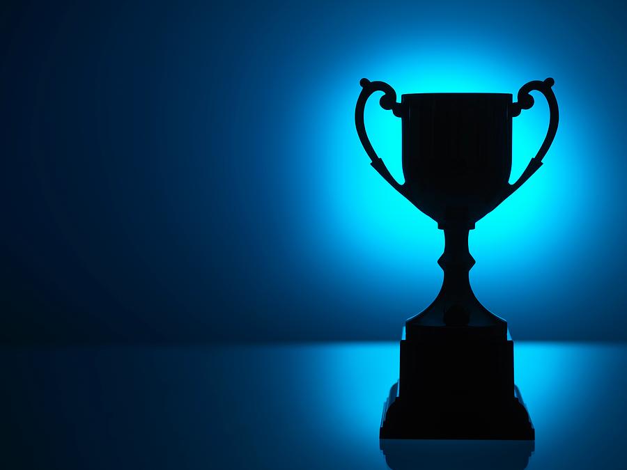 Silhouetted trophy with blue background Photograph by Andrew Brookes