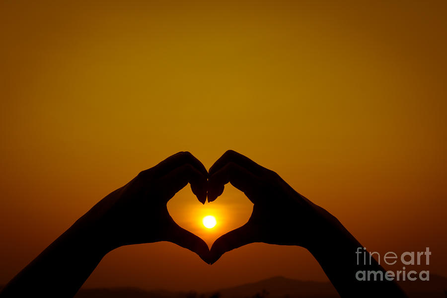 Silhouettes hand heart shaped Photograph by Tosporn Preede