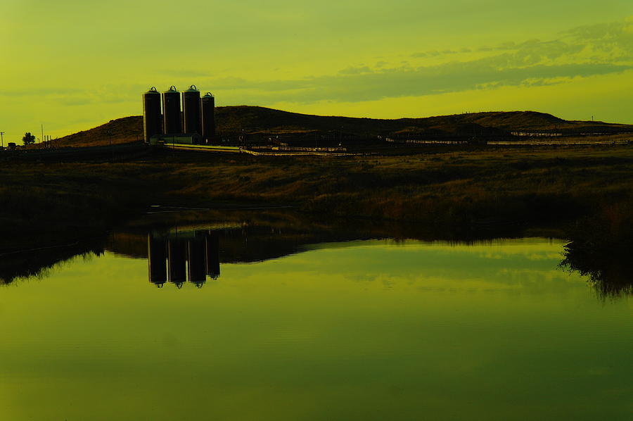 Farming Photograph - Silos reflecting in a pond by Jeff Swan