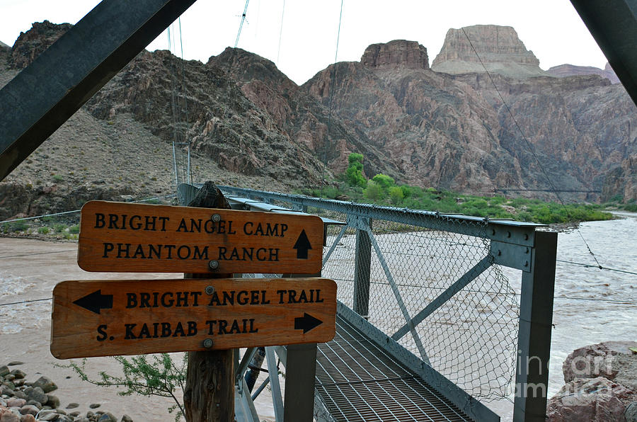 Silver Bridge Signs over Colorado River at bottom of Grand Canyon National Park Photograph by Shawn OBrien