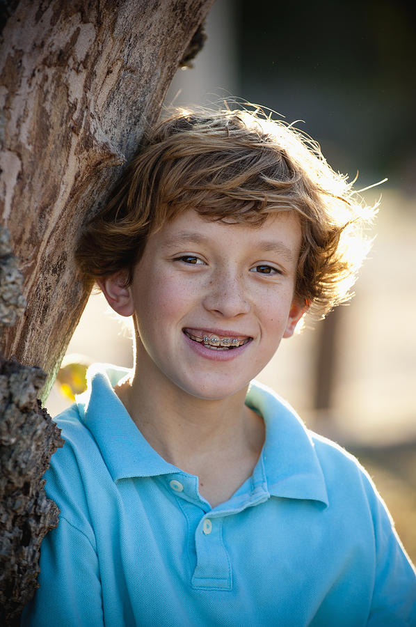 Simple Outdoor Portrait, Pre-teen Boy With Braces Photograph by Stephen Simpson