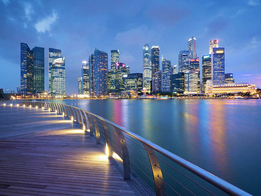 Singapore Skyline Seen Over Marina Bay Photograph by Travelpix Ltd