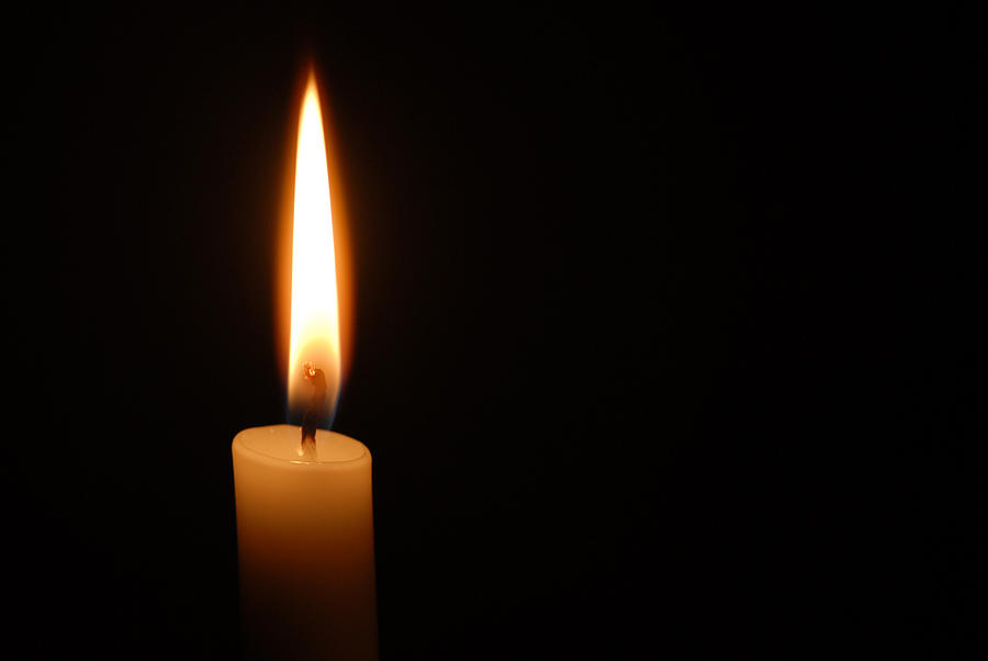 Single candle flame on horizontal black background Photograph by Lighthousebay Single candle flame on horizontal black background Photograph by Lighthousebay