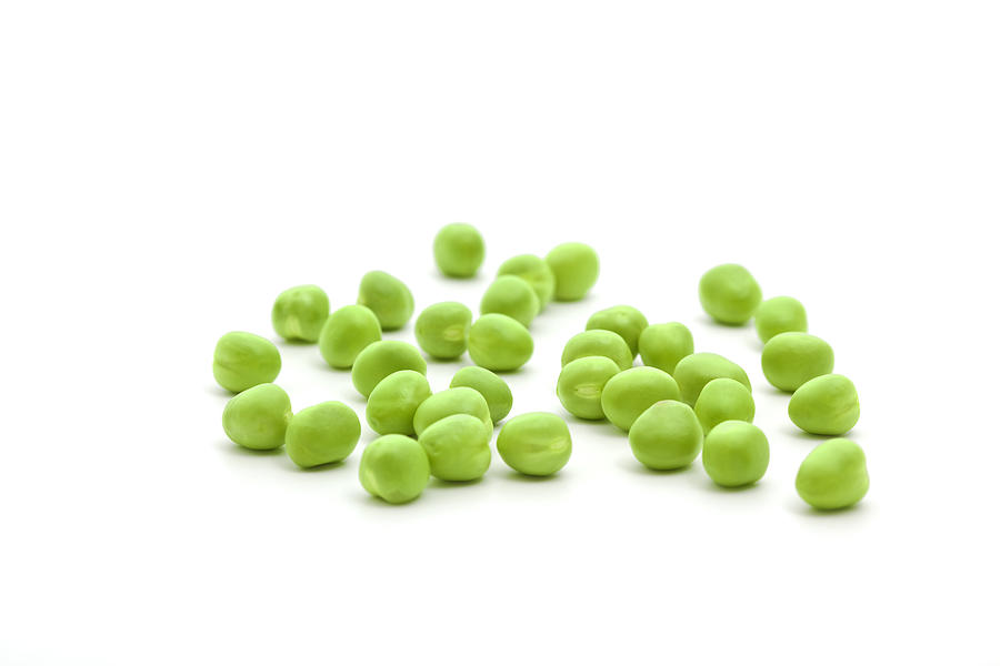 Single fresh green peas isolated on a white background Photograph by Gaffera