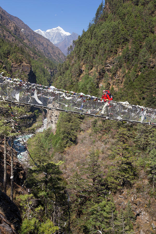 Single Male Hiker Crossing Rope Bridge Photograph by Menno