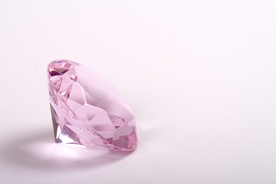 Single pink diamond on white background copyspace right Photograph by Ebrink