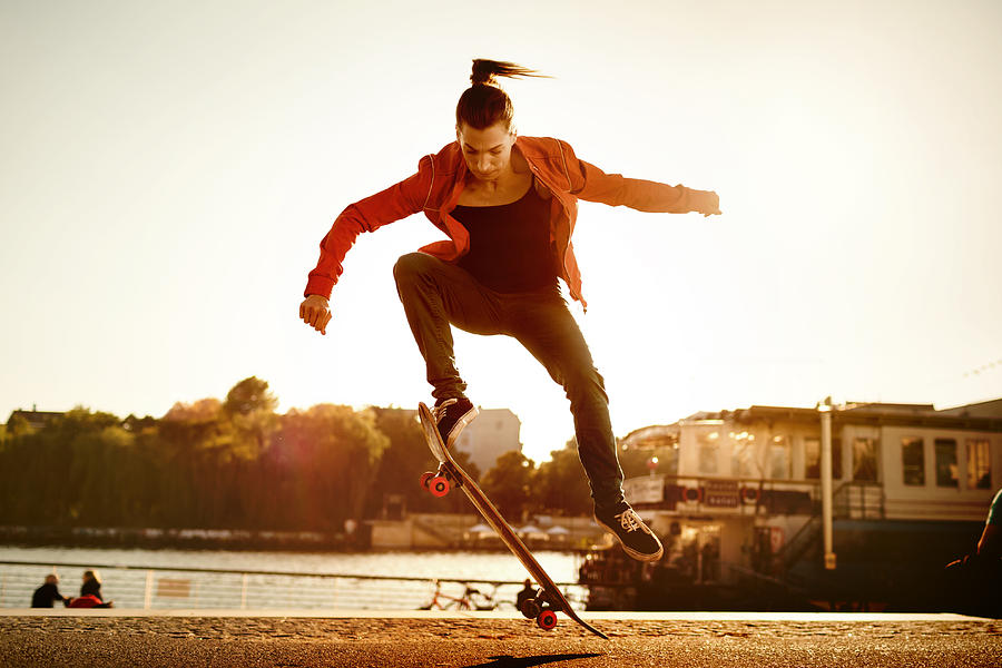 Skater Woman Jumping Photograph by Hinterhaus Productions
