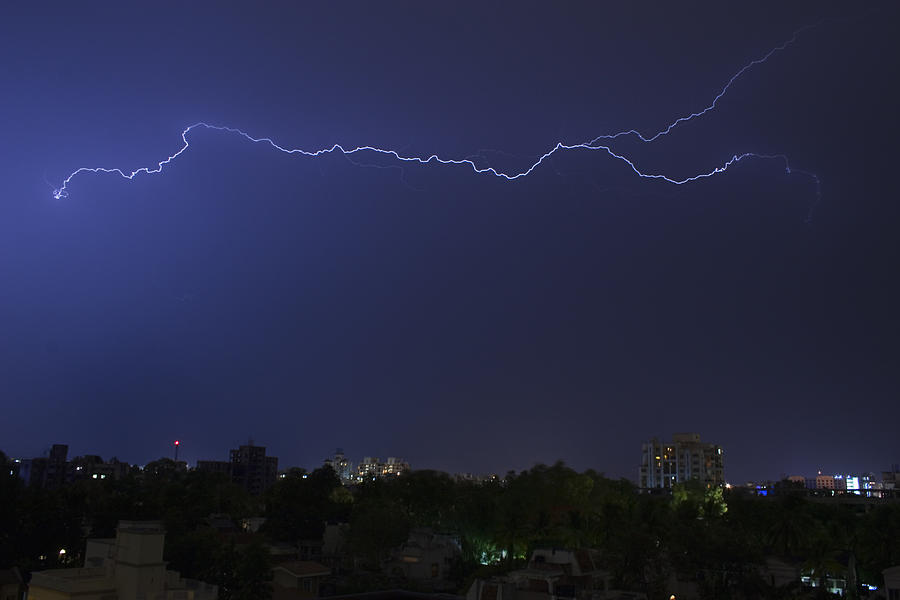 SKC 1451 Spark over a City Photograph by Sunil Kapadia