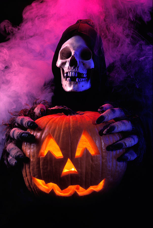 Skeleton holding pumpkin  Photograph by Garry Gay