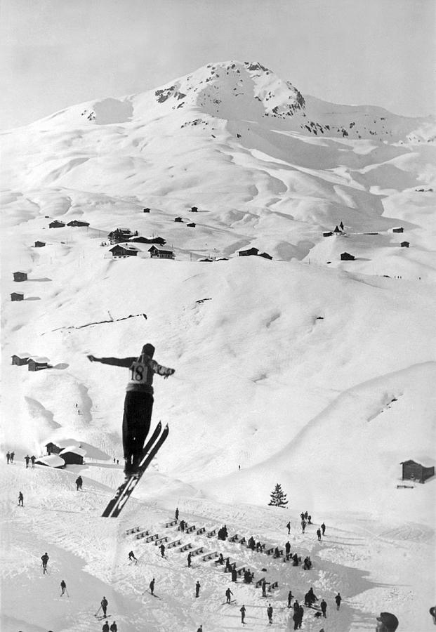 Skier Leaping Over A Valley Photograph by Underwood Archives