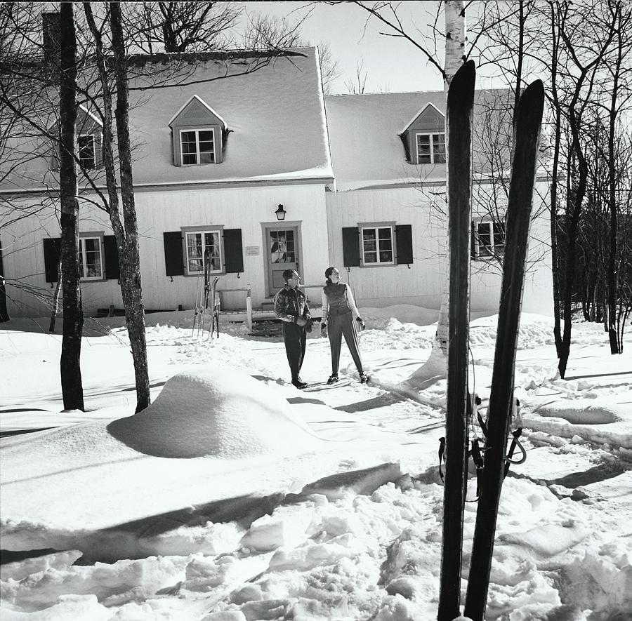 Skiers By A Ski Resort Cottage Photograph by Toni Frissell