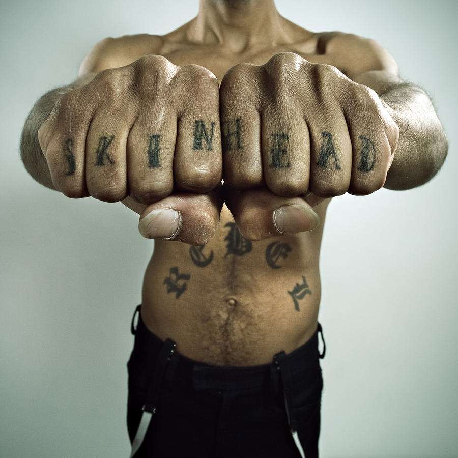 Skinhead Showing off Knuckle tattoo Photograph by SensorSpot