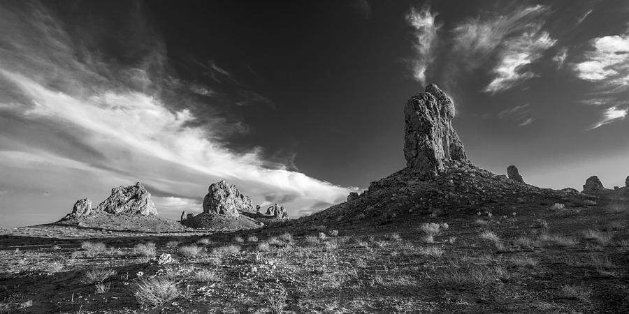 Sky Masters - Trona Pinnacles - Black and White Photograph by Peter Tellone