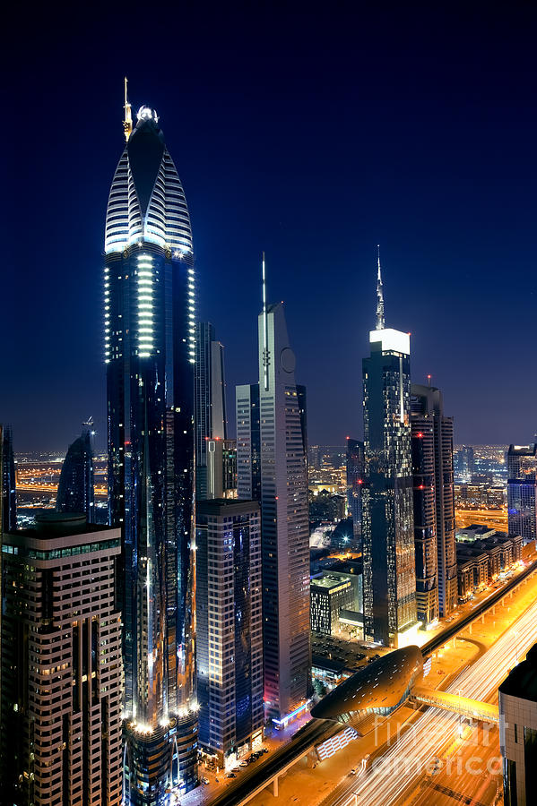 Architecture Photograph - Skyline of Dubai at Night by Fototrav Print
