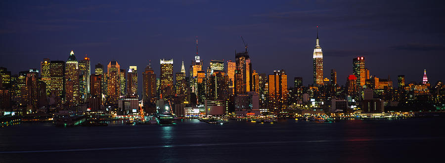Skyscrapers Lit Up At Night In A City Photograph by Panoramic Images