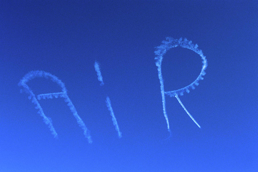 Airplane Photograph - Skywriting The Letters Air In Cloudless by Vintage Images