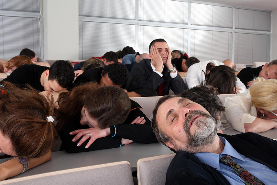 Sleeping audience at a boring business seminar Photograph by TadejZupancic