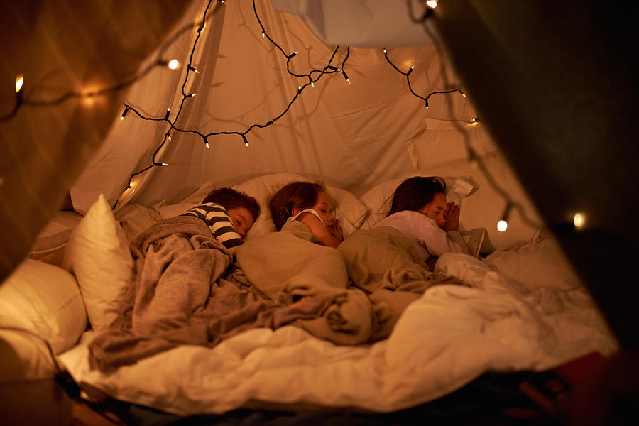 Sleeping in our imaginary tent Photograph by PeopleImages