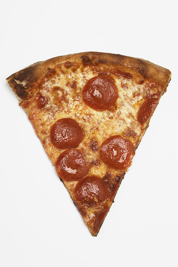 Slice of pizza, white background, overhead view Photograph by Raimund Koch