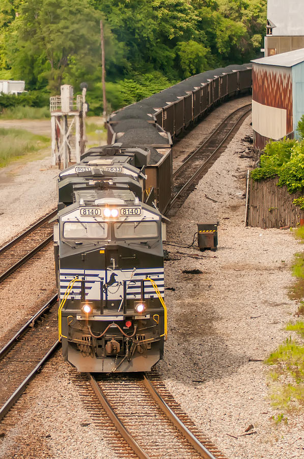 slow moving Coal wagons on railway tracks Photograph