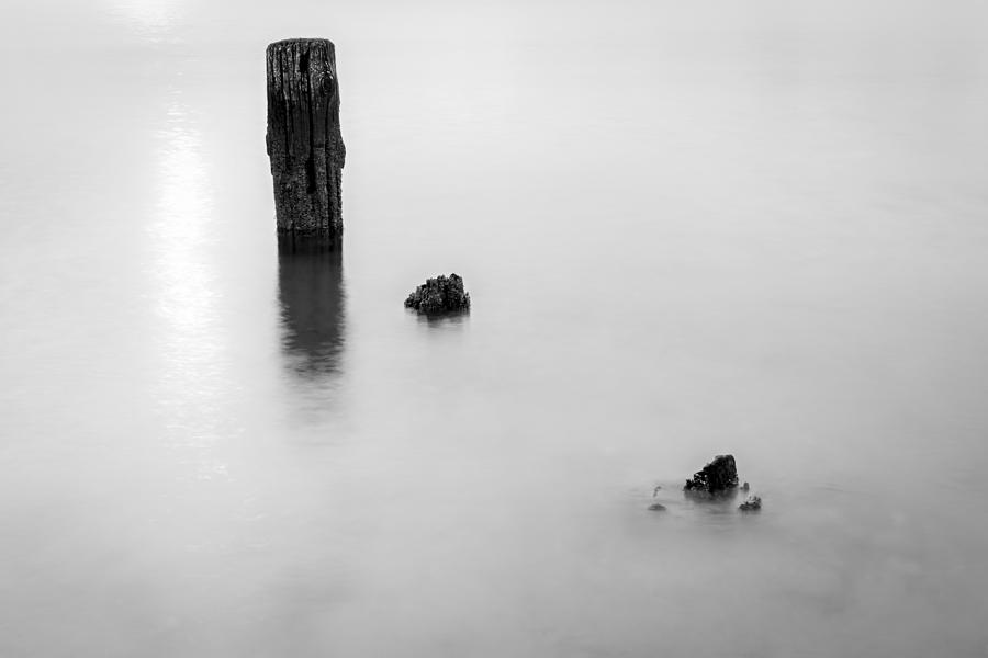Black And White Photograph - Slowly Washing Away by Andrew Pacheco