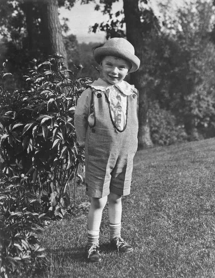 Small Boy Poses In Yard Photograph by Underwood Archives
