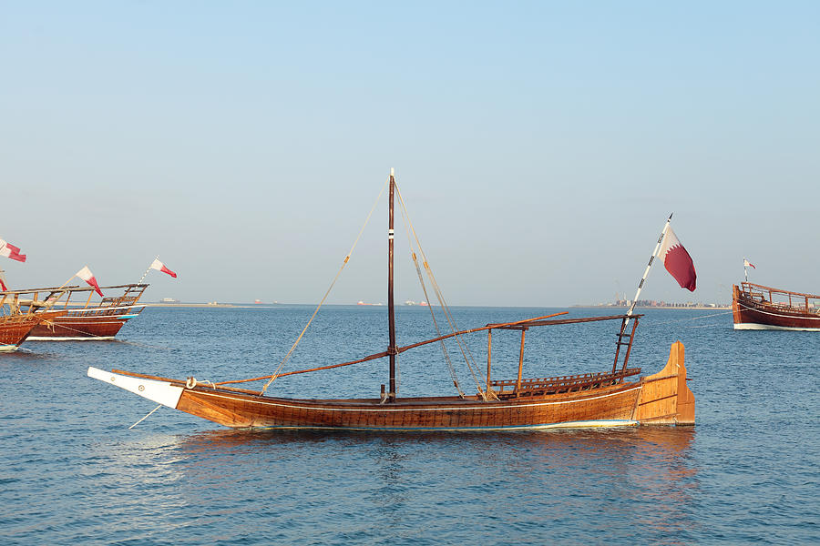 Small dhow in Doha Bay Photograph by Paul Cowan