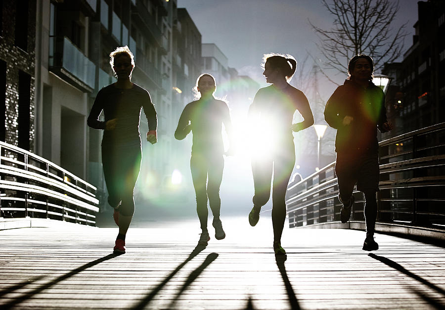 Small Group Of Runners Photograph by Henrik Sorensen