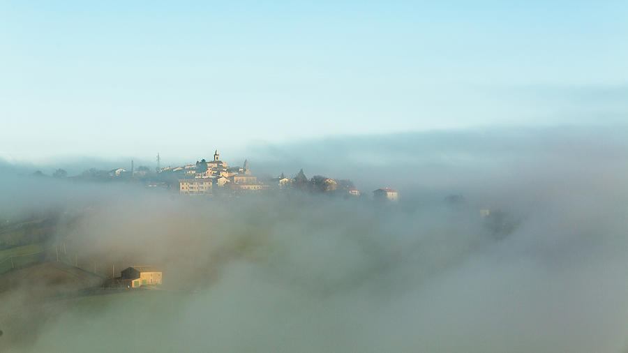 Small Italian Village In The Fog Photograph by Deimagine
